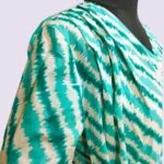 Zyenika Sawaan Front Open Shoulder Pleat Close Up